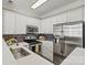 Contemporary kitchen with stainless steel appliances and white cabinets at 110 Dime Ln, Mooresville, NC 28117