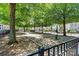 Park featuring mature trees, black metal fence, an open grassy area and a community park at 110 Dime Ln, Mooresville, NC 28117