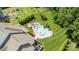 A backyard featuring a lovely pool, well-kept lawn, lounge furniture and a trampoline at 112 S Shore Dr, Belmont, NC 28012