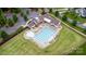 Aerial view of community pool and lounge area with chairs, tables and manicured landscaping at 112 S Shore Dr, Belmont, NC 28012