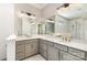 Bathroom featuring double sinks, gray cabinets, and a large mirror over the vanity at 112 S Shore Dr, Belmont, NC 28012