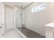 Bathroom featuring a modern glass shower, gray shower tile, and a white tile wall at 112 S Shore Dr, Belmont, NC 28012