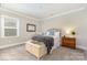 Bedroom with neutral color, natural light, and decorative wall mirror at 112 S Shore Dr, Belmont, NC 28012