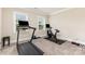 This exercise room features carpet floors, and fitness equipment for workouts at 112 S Shore Dr, Belmont, NC 28012