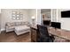 Functional home office featuring french doors, a sofa, and hardwood floors at 112 S Shore Dr, Belmont, NC 28012