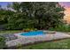 Backyard with a pool and hot tub, perfect for enjoying outdoor living and recreation at 112 S Shore Dr, Belmont, NC 28012