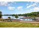 Scenic waterfront view featuring multiple boat slips and a beautiful lake surrounded by lush greenery at 112 S Shore Dr, Belmont, NC 28012