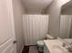Clean bathroom featuring a shower, toilet, vanity, and a window for natural light at 1139 Drummond Ln, Matthews, NC 28104