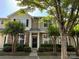Inviting townhome with a wreath-adorned front door, manicured shrubs, and lovely stone and siding accents at 1139 Drummond Ln, Matthews, NC 28104