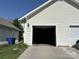 Exterior view of a two car garage, with home address visible at 1139 Drummond Ln, Matthews, NC 28104