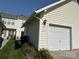Attached one car garage and manicured garden bed at 1139 Callonwood Ln at 1139 Drummond Ln, Matthews, NC 28104