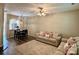 Inviting living space featuring comfortable seating, wood flooring, stylish lighting, and an open flow to the kitchen at 1139 Drummond Ln, Matthews, NC 28104