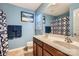 Stylish blue bathroom with a double sink vanity, modern fixtures, and decorative accents at 117 Marakery Rd # B, Mooresville, NC 28115
