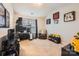 Spacious bedroom with neutral carpet, featuring sports-themed decor and a cozy armchair at 117 Marakery Rd # B, Mooresville, NC 28115