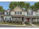 Charming townhomes with stone accents, well-maintained landscaping, and symmetrical window designs at 117 Marakery Rd # B, Mooresville, NC 28115