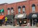 Street view of local bakery with black awnings, large windows, and a sidewalk for pedestrian traffic at 117 Marakery Rd # B, Mooresville, NC 28115