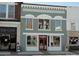 Newly renovated brick building with modern paint, large storefront windows, and decorative white trim at 117 Marakery Rd # B, Mooresville, NC 28115