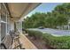 Inviting front porch area with outdoor seating, manicured bushes, and views of the neighborhood at 117 Marakery Rd # B, Mooresville, NC 28115