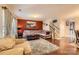 Comfortable living room featuring hardwood floors, a plush sectional sofa, and staircase at 117 Marakery Rd # B, Mooresville, NC 28115