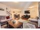 Open-concept living space with a dining area, wood floors, and a modern decor at 117 Marakery Rd # B, Mooresville, NC 28115