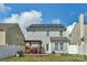 Large backyard featuring a wooden deck with pergola and solar panels on roof at 1177 Bannockburn Ave, Rock Hill, SC 29732