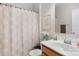 Cozy bathroom with shower, patterned shower curtain, and vanity with modern fixtures at 1177 Bannockburn Ave, Rock Hill, SC 29732