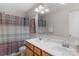 Neutral bathroom featuring double basin vanity, large mirror, wood cabinets, and combination shower and tub at 1177 Bannockburn Ave, Rock Hill, SC 29732
