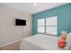 Bright bedroom with a plush carpet, neutral wall and an accent wall with a tv at 1177 Bannockburn Ave, Rock Hill, SC 29732