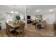 Dining room features hardwood floors and an open floor plan leading to living room and kitchen at 1177 Bannockburn Ave, Rock Hill, SC 29732