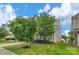 Well-maintained home with mature trees, lush lawn, and a side view of the property at 1177 Bannockburn Ave, Rock Hill, SC 29732