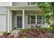 Well-maintained home with a covered front porch and a colorful front yard garden at 1177 Bannockburn Ave, Rock Hill, SC 29732