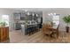 Bright, gray kitchen with sleek appliances, center island with seating, and wood flooring throughout at 1177 Bannockburn Ave, Rock Hill, SC 29732