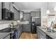 Bright kitchen with stainless steel appliances, granite countertops, and modern cabinetry at 1177 Bannockburn Ave, Rock Hill, SC 29732