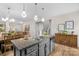 Kitchen island featuring granite countertops, stainless steel appliances, and an open layout at 1177 Bannockburn Ave, Rock Hill, SC 29732