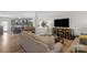Open-concept living room features modern decor and a seamless transition to the dining and kitchen areas at 1177 Bannockburn Ave, Rock Hill, SC 29732