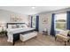 Bright main bedroom features ample natural light, carpet flooring, a decorative accent bench, and calming neutral tones at 1177 Bannockburn Ave, Rock Hill, SC 29732