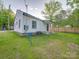 Cozy home featuring a well-maintained lawn and fenced yard for outdoor living at 123 Oak St, Chester, SC 29706