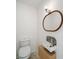 Compact bathroom showcasing a decorative sink, modern toilet, and stylish mirror at 123 Oak St, Chester, SC 29706