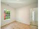 Bright room showing new flooring, a window, and an open doorway at 123 Oak St, Chester, SC 29706