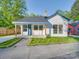 Charming single-story home featuring a cozy porch and freshly painted exterior with great curb appeal at 123 Oak St, Chester, SC 29706
