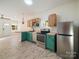Inviting kitchen with stainless steel appliances, wooden cabinets, an open design for modern living at 123 Oak St, Chester, SC 29706