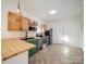 Charming kitchen features modern appliances, stylish cabinets, and beautiful, refinished butcher-block countertops at 123 Oak St, Chester, SC 29706