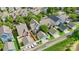 Drone perspective showcases a residential area, with houses, lawns, and tree-lined streets at 132 E Morehouse Ave, Mooresville, NC 28117