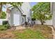 Cozy backyard features an outdoor seating area and a view of the green grass and garden at 132 E Morehouse Ave, Mooresville, NC 28117