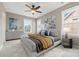 Stylishly furnished bedroom with neutral colors, large windows, ceiling fan, and coordinated decor at 132 E Morehouse Ave, Mooresville, NC 28117