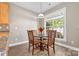 Cozy dining area featuring a wooden table set near a bright window at 132 E Morehouse Ave, Mooresville, NC 28117