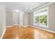 Bright dining room featuring hardwood floors, chandelier, and large window at 132 E Morehouse Ave, Mooresville, NC 28117