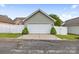 Detached garage showcases a clean design, green trim, and a neatly manicured lawn at 132 E Morehouse Ave, Mooresville, NC 28117