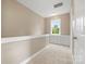 Hallway with neutral walls, carpet and a window with built in shelving underneath at 132 E Morehouse Ave, Mooresville, NC 28117