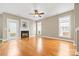 Inviting living room with fireplace, wood floors, and natural light at 132 E Morehouse Ave, Mooresville, NC 28117